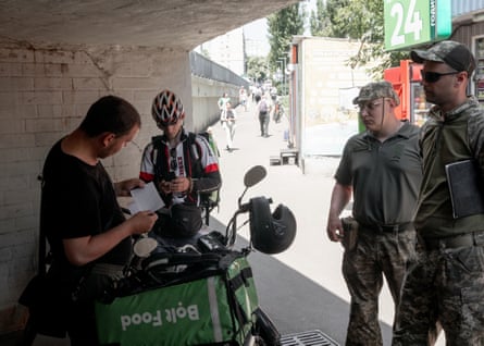 Pimahkov and Pikhota with two bike delivery couriers