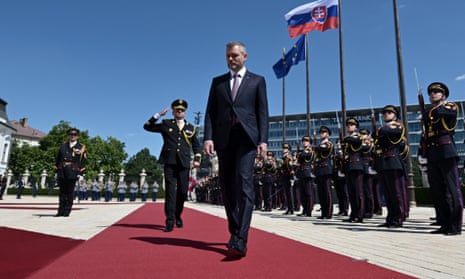 Peter Pellegrini reviews a military honor guard in the courtyard of the Presidential Palace in Bratislava, Slovakia, after his swearing-in ceremony.
