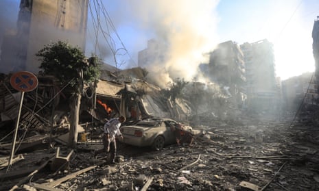A man walks amid the rubble of a building hit in an overnight Israeli airstrike that targeted the neighbourhood of Moawwad in Beirut’s southern suburbs on Thursday.