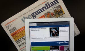 The Guardian newspaper in print on and on ipad. Photograph: Graham Turner.