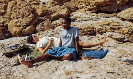 two women on some rocks, Erivo sitting, Shawkat lying