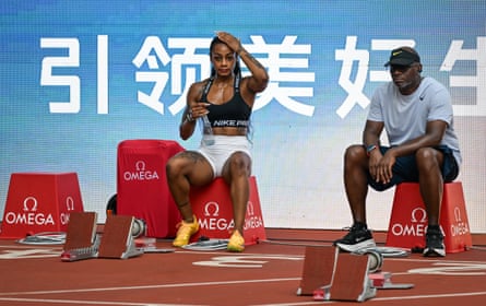 ShaâÂÂCarri Richardson talks with her coach, Dennis Mitchell, during a training session ahead of the Xiamen Diamond League meeting in China in May.