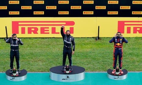 Lewis Hamilton performs a black power salute on the podium after winning the Styrian GP, with Valtteri Bottas and Max Verstappen second and third.