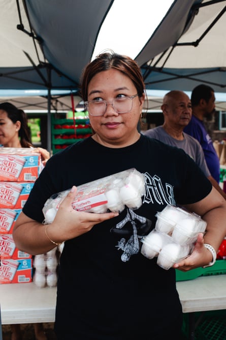 a woman holding eggs