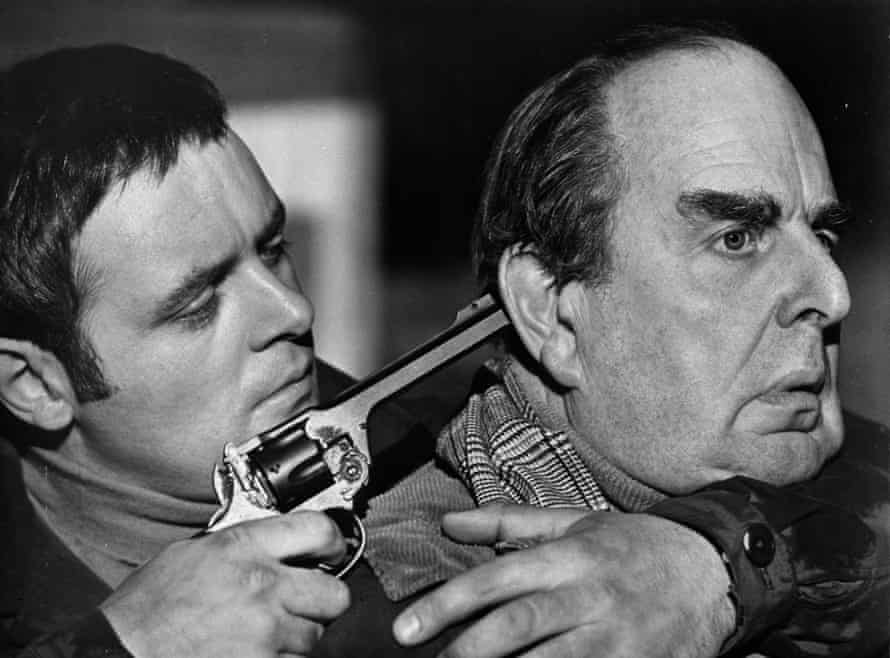 Anthony Hopkins grabs Robert Morley in a scene for the movie When Eight Bells Toll, 1971.