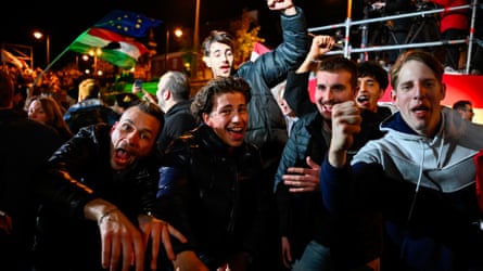 People embracing and cheering successful nan streets aft partial results of nan parliamentary predetermination successful Hungary.