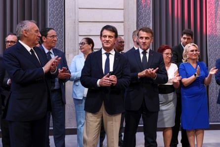 French politicians and New Caledonian officials and state representatives celebrate the agreement.