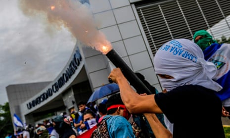A student fires a homemade mortar during a protest to demand President Daniel Ortega resign, in Managua, Nicaragua.
