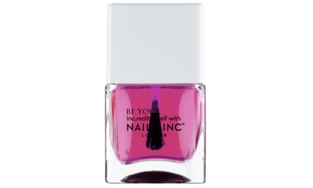 A bottle of clear pink nail varnish with a white lid