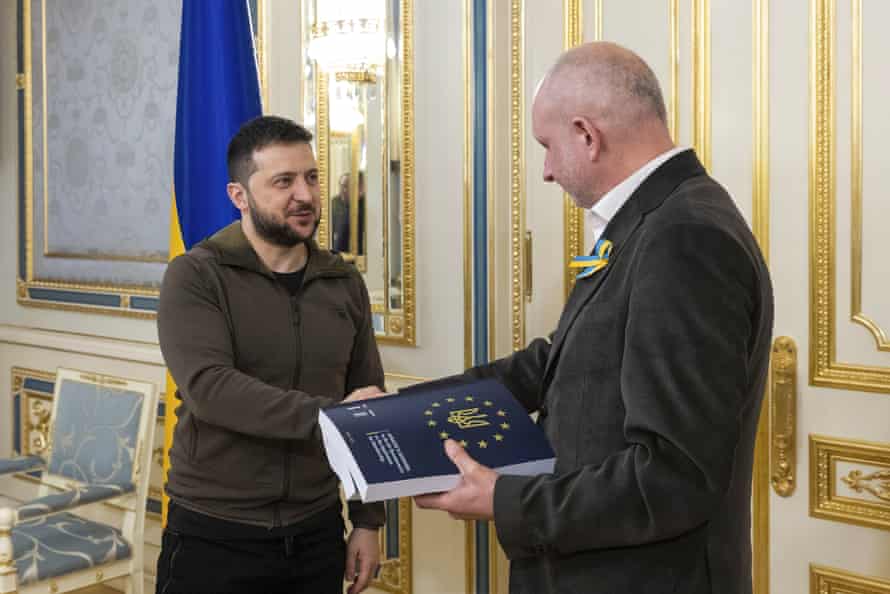 Ukrainian President Volodymyr Zelenskiy presents Matti Maasikas, head of the delegation of the European Union to Ukraine, with the two-volume set of Ukraine’s answers to the European Union questionnaire, the first step in his campaign to obtain accelerated EU membership, in Kyiv, on Monday.