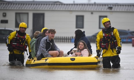 People are rescued from their holiday chalets by fire and rescue at Freshwater Beach Holiday Park, on November 02, 2023 in Burton Bradstock, Dorset. Storm Ciaran swept across the southwest and south of England overnight posing a formidable threat in certain areas such as Jersey, where winds exceeded 100 mph overnight. This, along with the already-soaked ground from Storm Babet, increases the risk of flooding in already vulnerable areas.