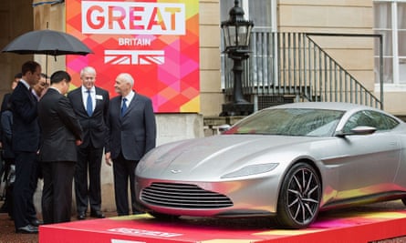Prince William and Xi view an Aston Martin DB10 sports car at Lancaster House in London.