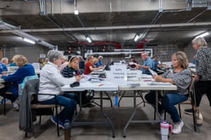 Poll workers process ballots at City Hall in Janesville Wisconsin