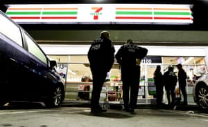 Immigration and Customs Enforcement (Ice) agents outside a 7-Eleven convenience store in Los Angeles, where recent raids were conducted.