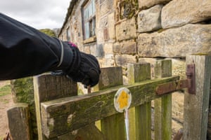 Is this the new normal? A walker uses a stick to open a gate in Wharfedale, West Yorkshire.