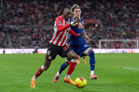 Bertrand Traoré of Sunderland takes the ball past Anthony Gordon of Newcastle United.
