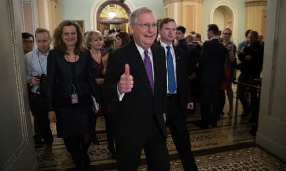Senate majority leader Mitch McConnell gives the thumbs up as he walks off the Senate floor.
