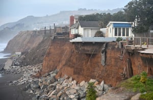 Sections of land missing from coastal properties in Pacifica, California, in 2016. Storms and powerful waves have intensified erosion along nearby coastal bluffs and beaches in the area.