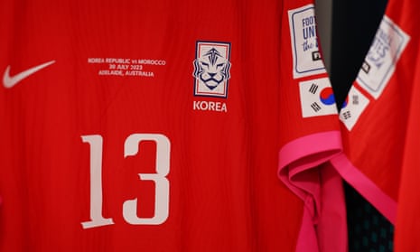 Korea will be wearing their home strip of red with magenta trim.