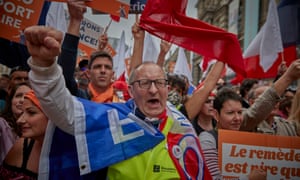 Demonstrators protest in Paris against controversial new restrictions announced by Emmanuel Macron last week.