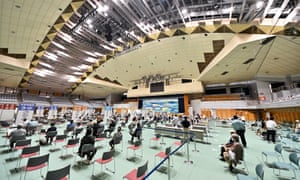 Elderly people wait to receive their Covid-19 vaccines in Naha, Okinawa, Japan.