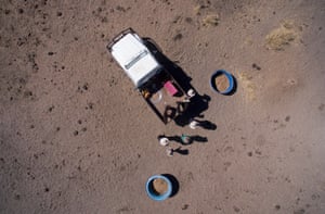 Doug and Rachelle Cameron and their children Stirling, Ella and Grace at a feeding point on their property, Nive Downs.