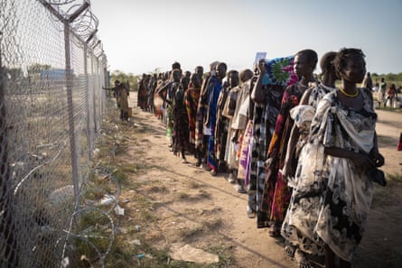 Women from Murle ethnic group wait in line for food distribution