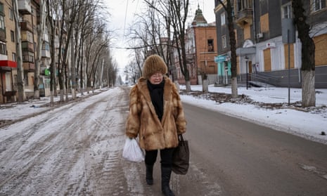 A local resident walks in an empty street in the front line city of Bakhmut.