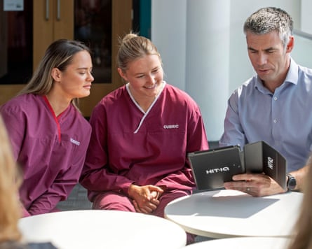 Dr Peter Theobald with rugby players Ffion James (left) and Cleo Pallister-Turley.