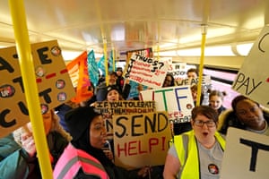 London, UKStriking teachers from the National Education Union travel on a bus into central London to take part in a rally in support of industrial action