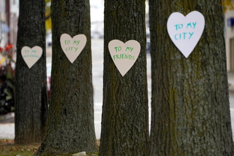 Heart-shaped cut-outs with messages of positivity adorns trees in downtown Lewiston, Maine, Thursday, Oct. 26, 2023.