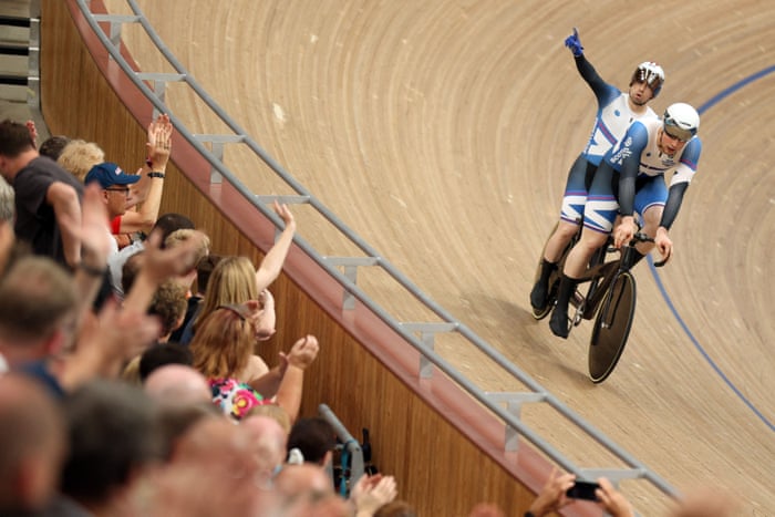 Neil Fachie and pilot Lewis Stewart salute the crowd.