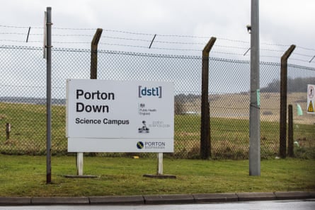 A sign in front of the entrance at Porton Down. It says Porton Down Science Campus, and is in front of a high wire fence.