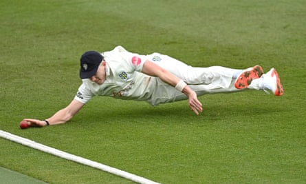 Matthew Potts dives to stop a boundary during the match between Warwickshire and Durham.