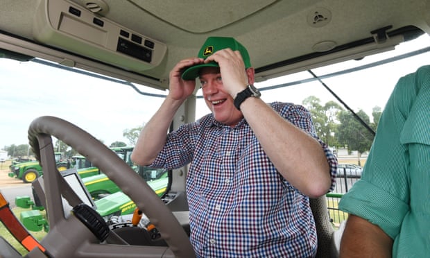 Queensland Opposition Leader Tim Nicholls drives a tractor during a visit to a John Deere dealership in Emerald, Friday, November 17, 2017. Mr Nicholls is on the campaign trail ahead of the November 25 state election. (AAP Image/Dan Peled) NO ARCHIVING