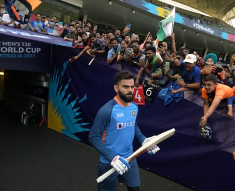 India's Virat Kohli looks focused as he walks past spectators as he takes to the field for the warm up ahead.