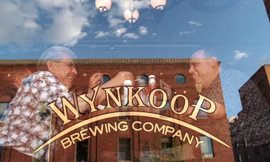 Wynkoop Brewing Company exterior shot of window with bar sign in it.