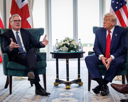 Donald Trump and Keir Starmer talking while seated opposite each other