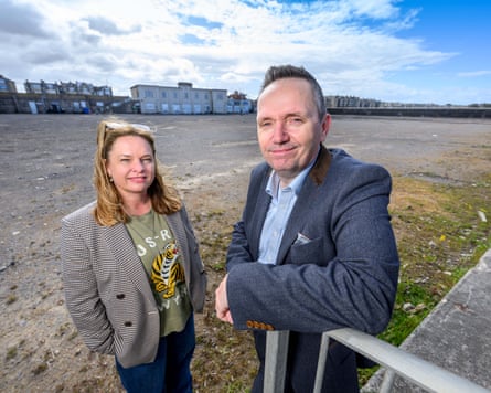 Kemsley and Bell stand in the vast expanse of the hollowed out lido