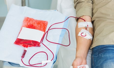 A person receives a blood transfusion