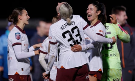 Manchester City’s Leila Ouhabi (right) and Alanna Kennedy celebrate after the match.