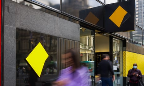 People walk past a Commonwealth Bank branch