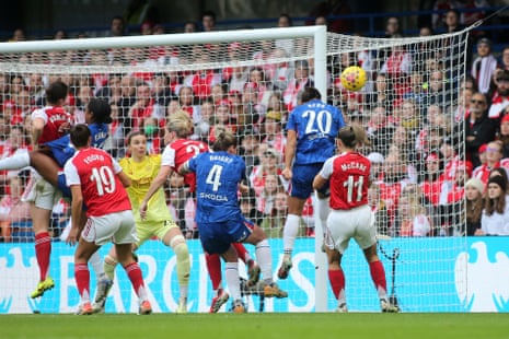 Sam Kerr of Chelsea heads just wide of the Arsenal goal.