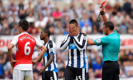 Newcastle’s Aleksandar Mitrovic puts his head in his hands when shown a red card