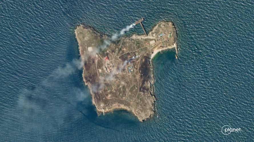 Smoke rises from Snake Island in this satellite image taken on 29 June.