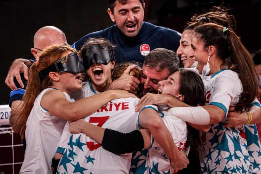 Turkey’s players and staff celebrate their victory during the women’s semi-final goalball match between Turkey and Japan during the Tokyo 2020 Paralympic Games at Makuhari Messe Hall in Chiba on September 2