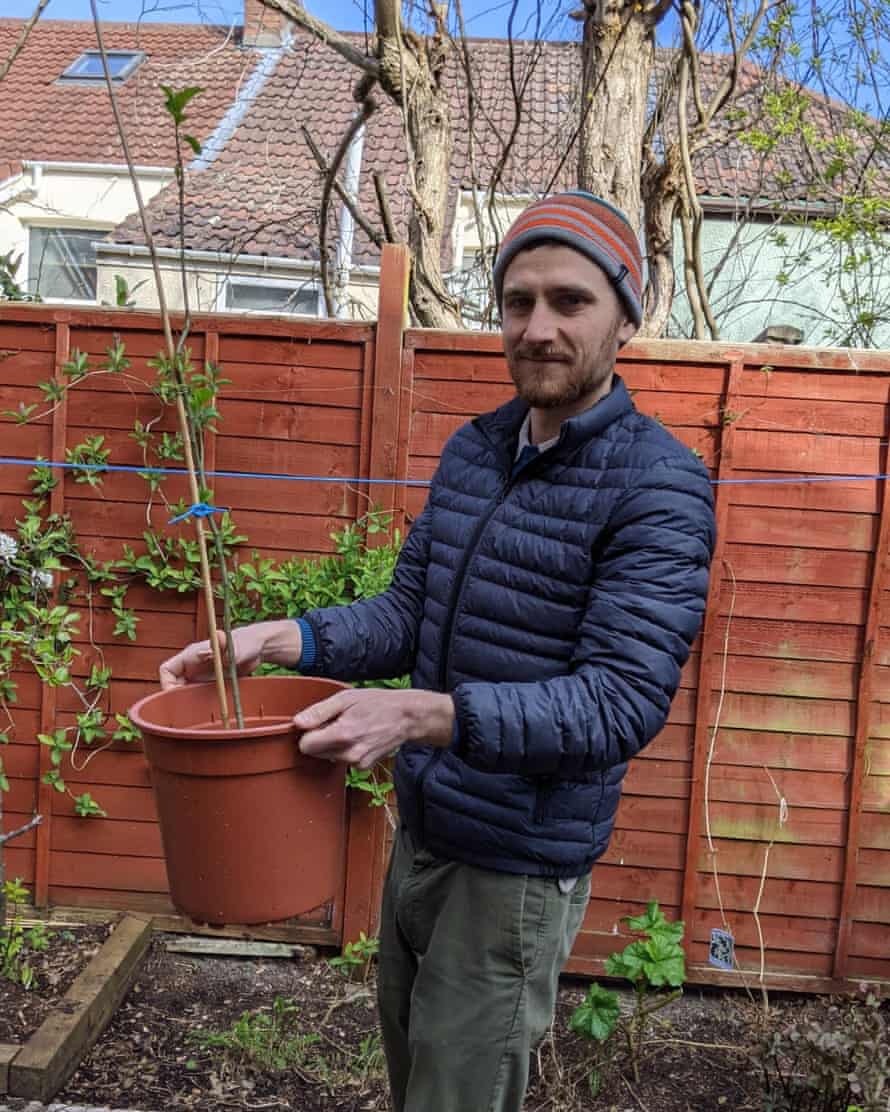 Tom Urry and the apple tree he has grown at home.