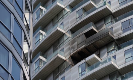 Scorched and smoke-blackened balcony and windows on a modern tower block