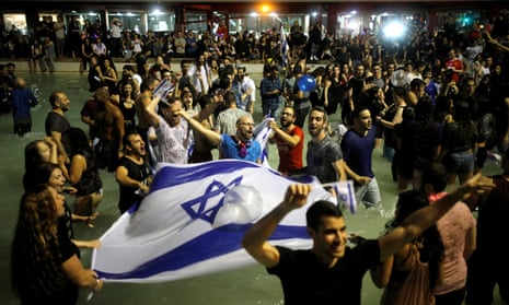 Fans celebrate in Tel Aviv after Israeli singer Netta Barzilai won the Eurovision Song Contest in 2018.