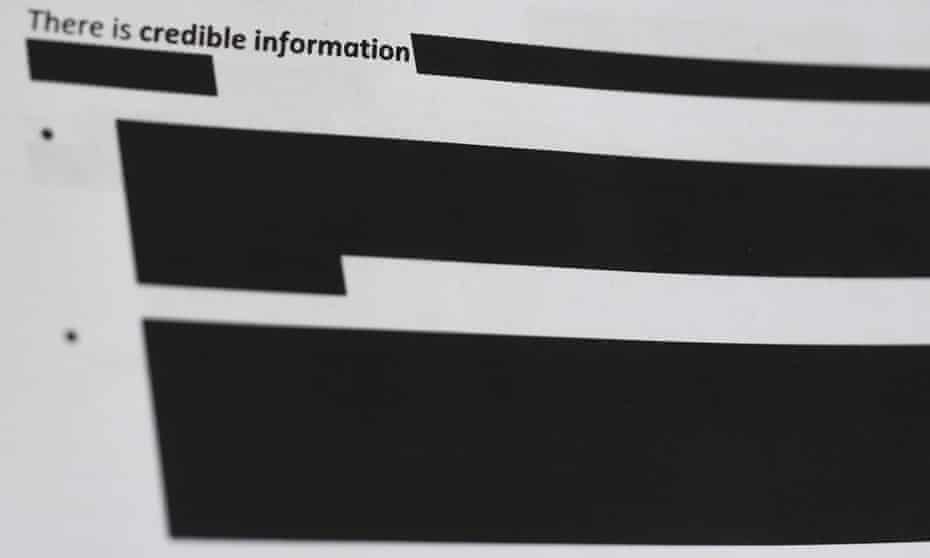 Redacted parts of a document are seen 